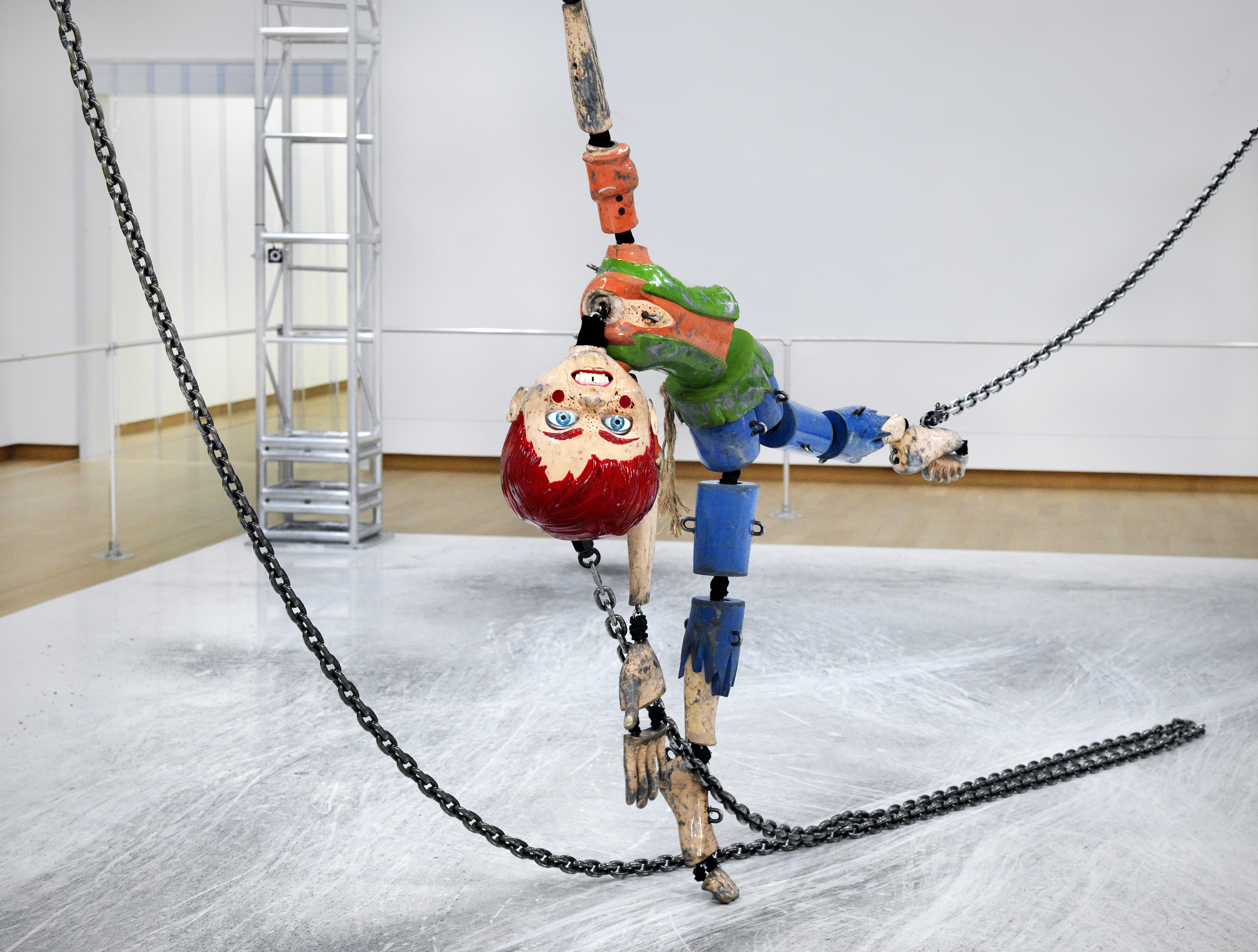 This Human-Sized Marionette in Chains Is Just Uncomfortable