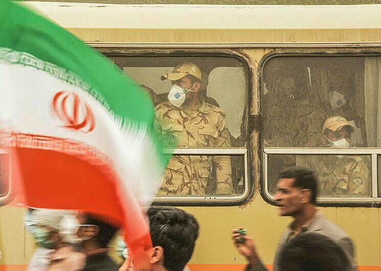 Soldiers on a bus during a dust storm in 2016. Image: Ali Shakiba