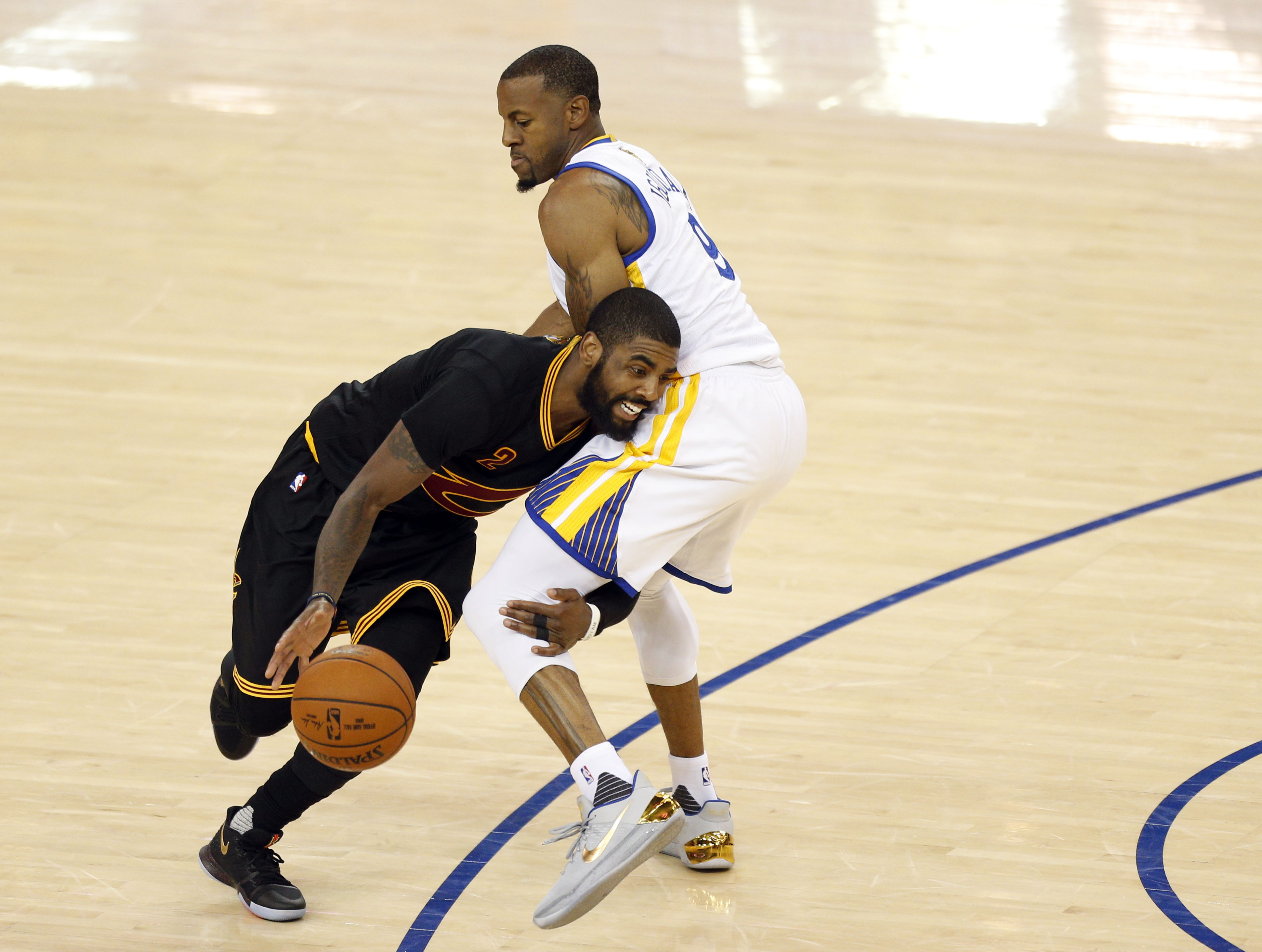 Andre Iguodala guards Kyrie Irving