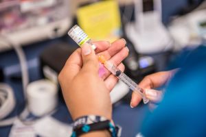 nurse preparing HPV vaccine