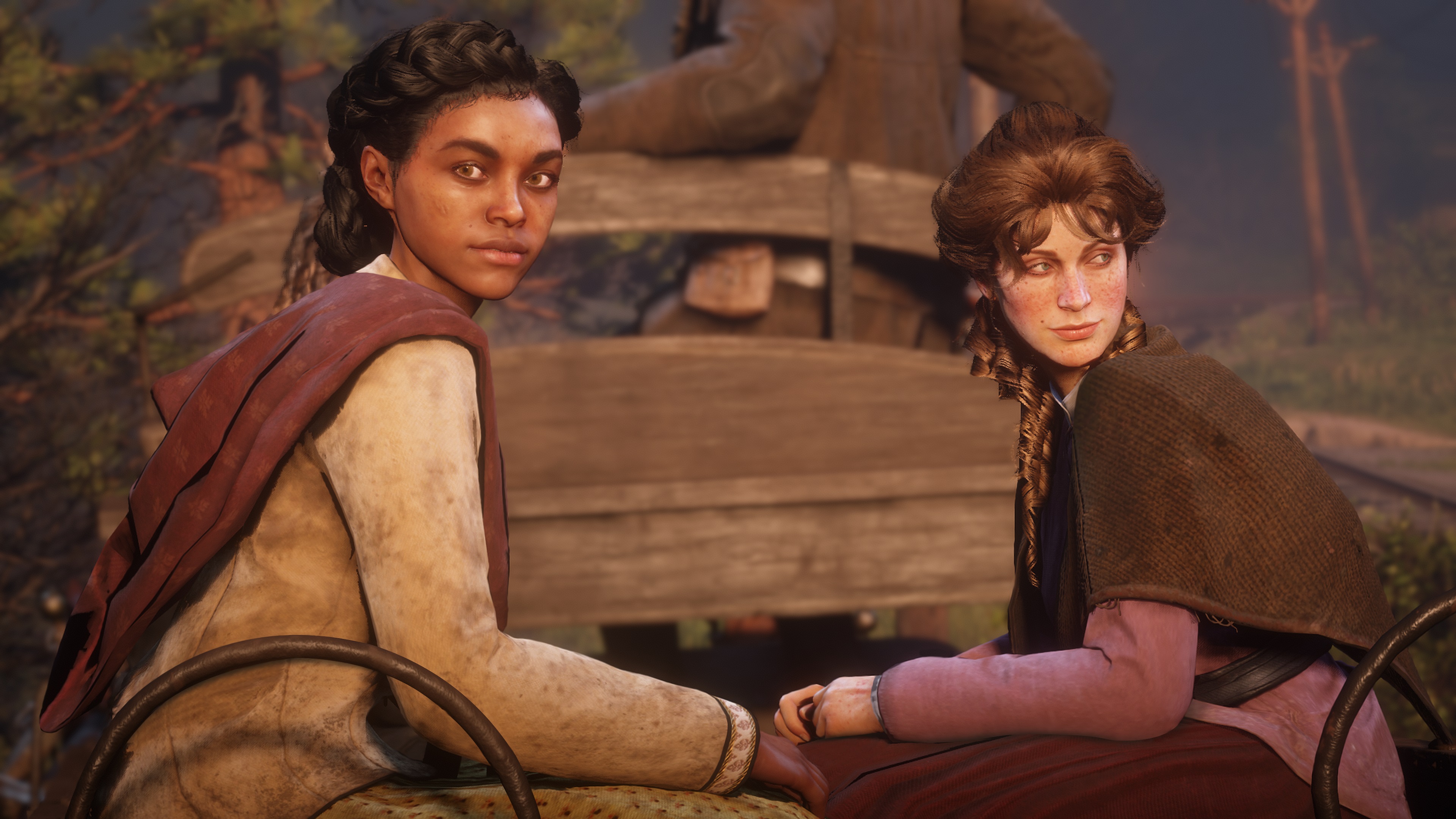 Two of the Van der Linde gang's members, Mary-Beth and Tilly sit side-by-side in the back of a wagon looking somewhat sardonically back at the viewer, dressed in the well-worn but still stylish and cared-for clothes that give them an air of frontier glamor and sophistication that turns even that old wagon into a fancy carriage whisking its passengers to some new adventure.