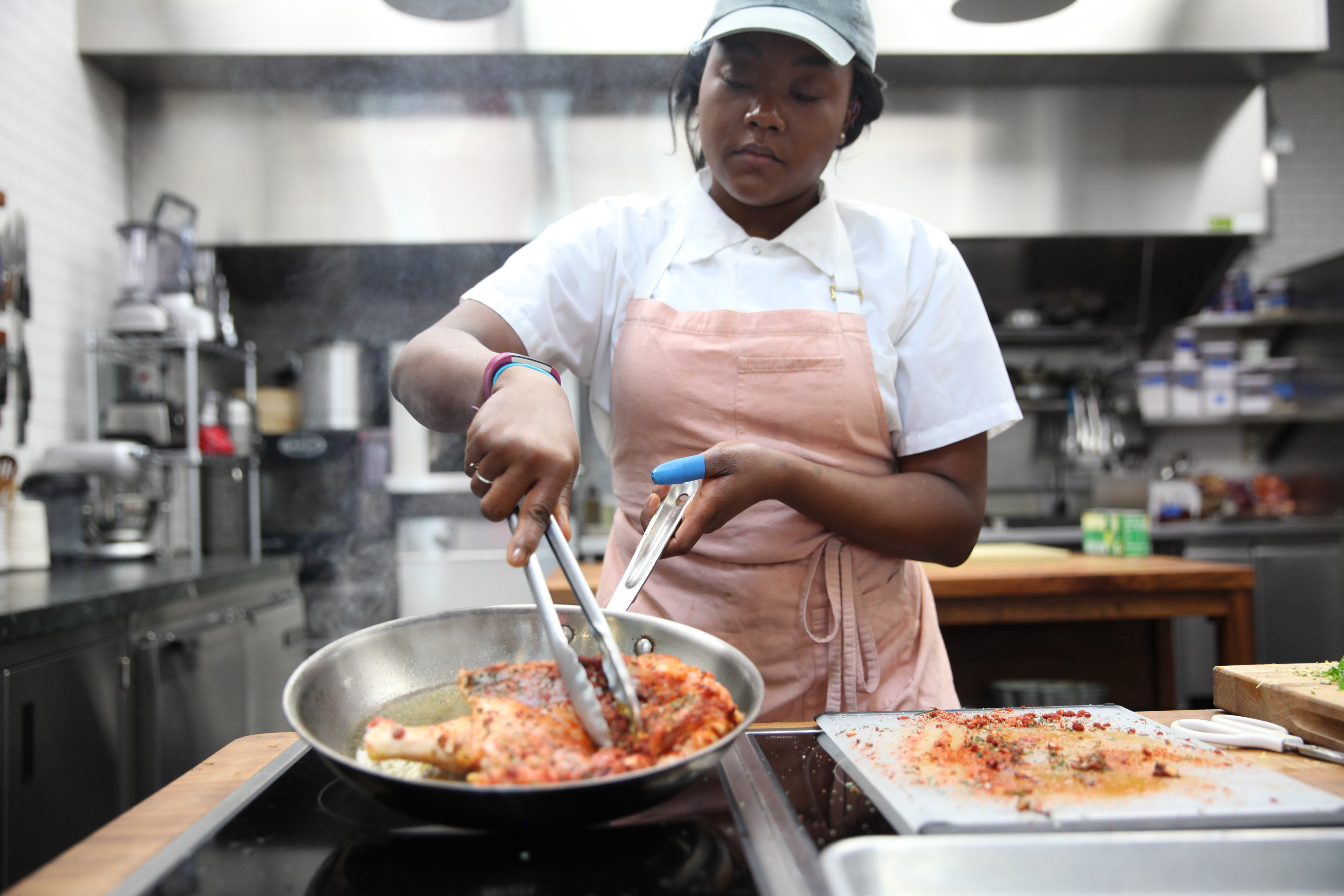 Ashley Eddie searing chicken