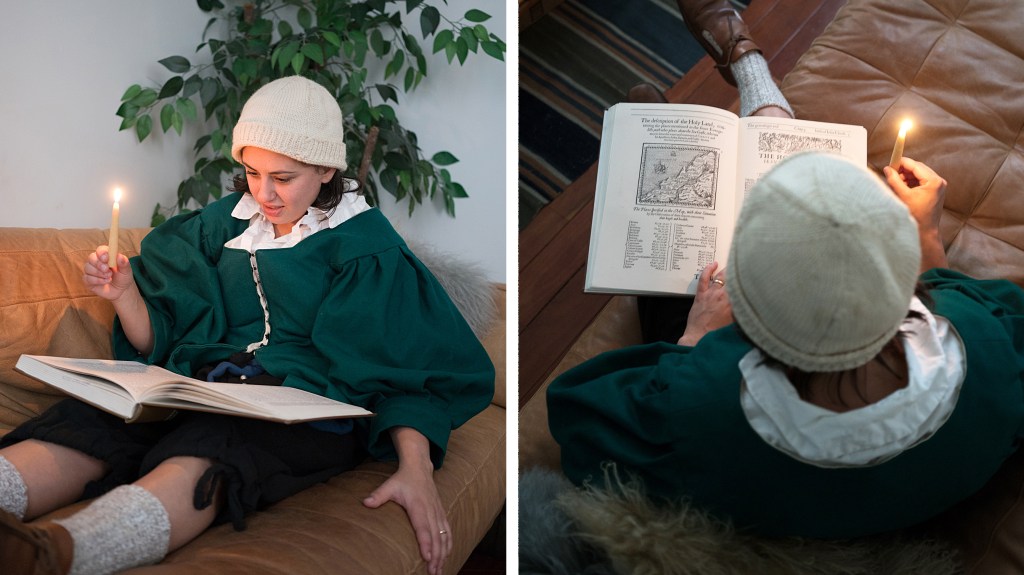 Allie Conti reads by candlelight in period-appropriate garb.