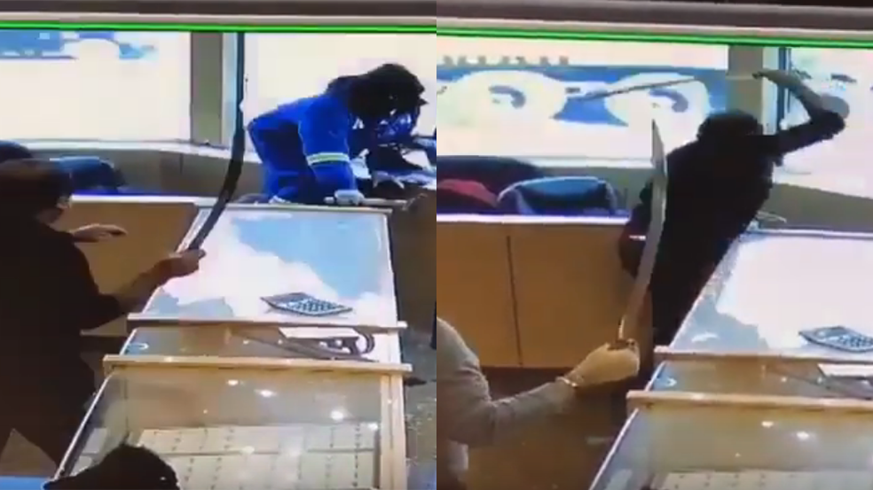 A man with a sword chases away robbers.