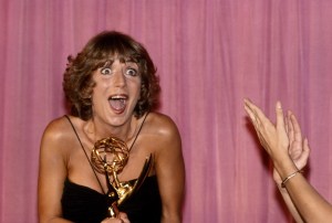 Penny Marshall holding a Primetime Emmy