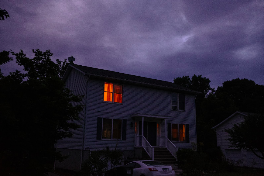 House in the dark an orange window