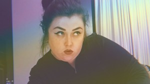 The author reclining on bed.