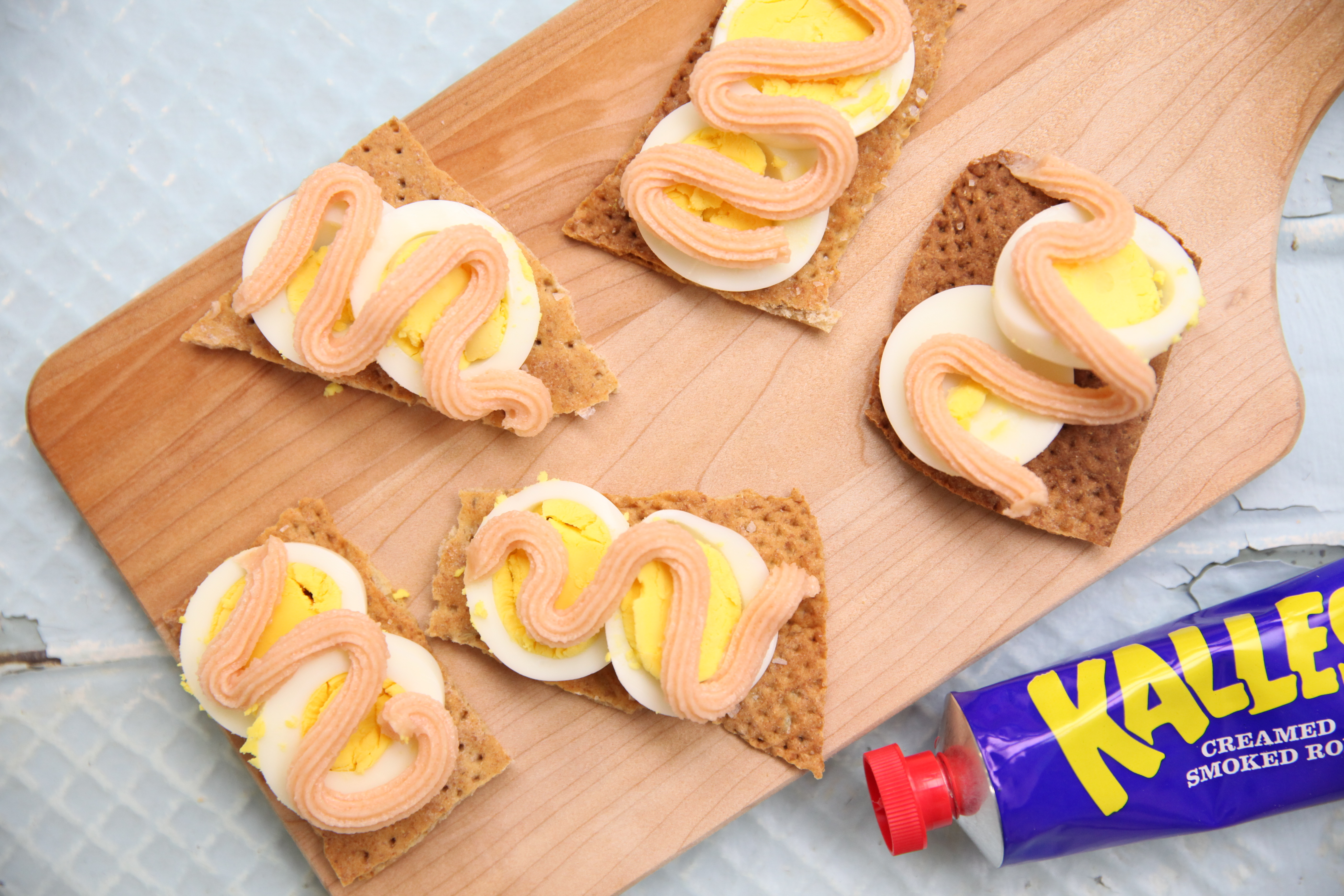 swedish knackebrod topped with an egg and kalles smoked roe