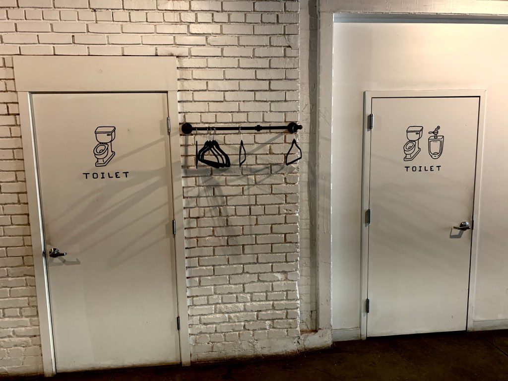 the before picture of the gender-neutral toilets at good company in cleveland, ohio