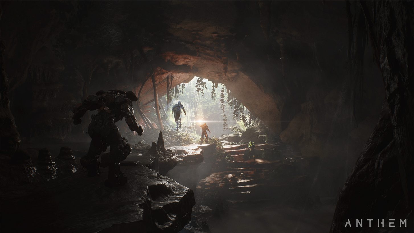 Javelin suits fly through the mouth of a dimly lit cave in Anthem