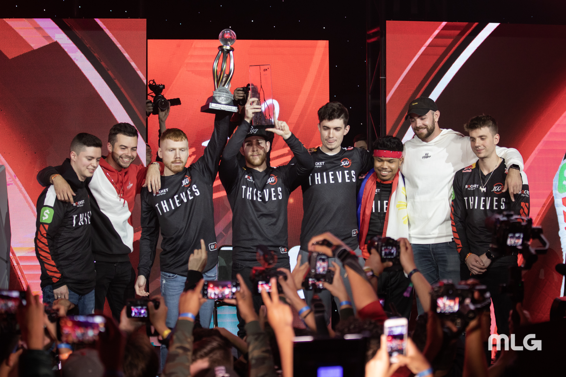 The 100 Thieves Roster celebrates after winning a tournament,