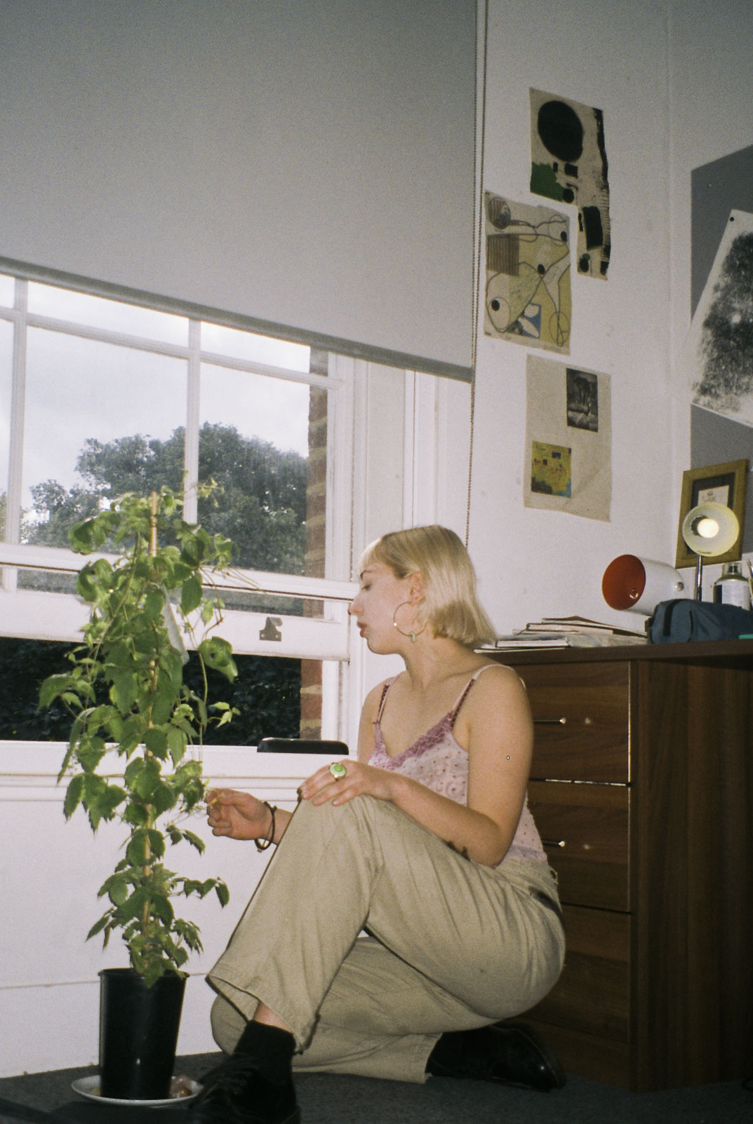 Girl with plant by Emily Bowler