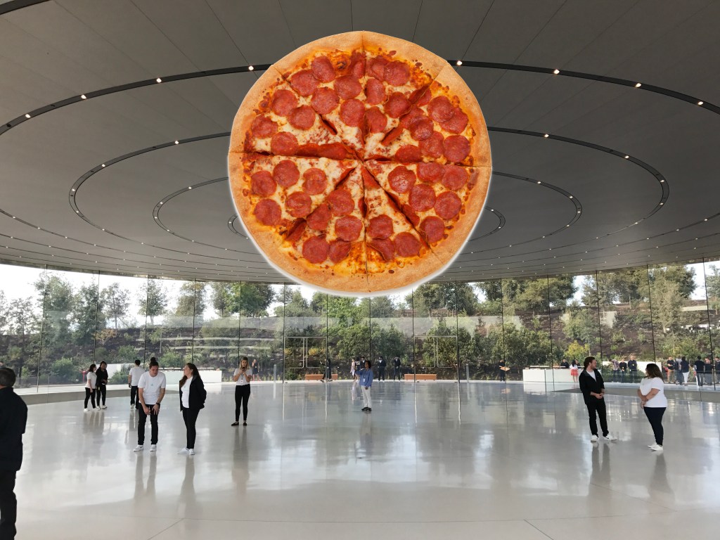 A (not Apple) pizza floating the air at the Apple HQ.