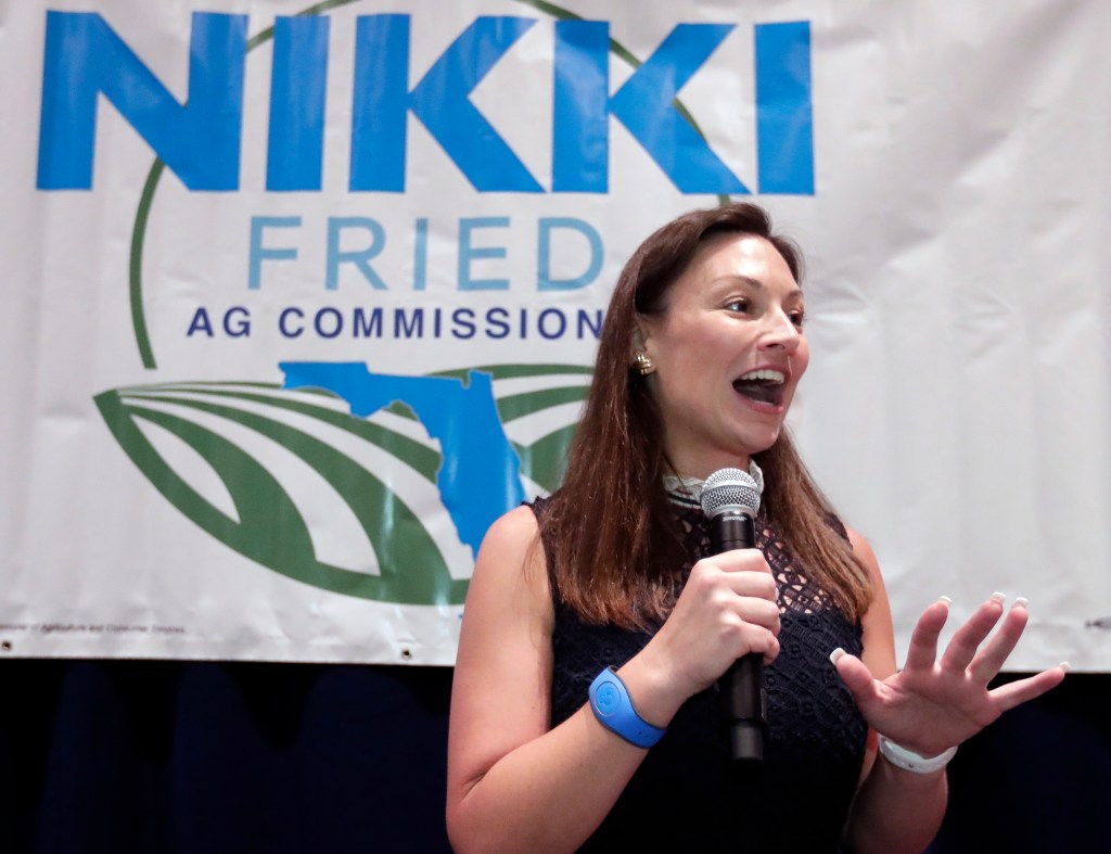 Nikki Fried, Florida's newly-elected Democrat commissioner of Agriculture and Consumer Services, speaks at a reception during the Florida Democratic Party state conference, Friday, June 7, 2019, in Orlando, Fla. (AP Photo/John Raoux)