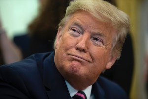 President Donald Trump smiles during an event on prayer in public schools, in the Oval Office of the White House, Thursday, Jan. 16, 2020, in Washington. (AP Photo/ Evan Vucci)