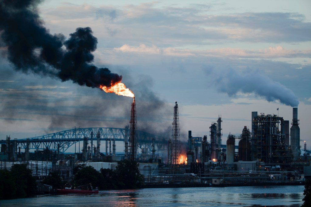 In this June 21, 2019 file photo, flames and smoke emerge from the Philadelphia Energy Solutions Refining Complex in Philadelphia. (AP Photo/Matt Rourke, File)