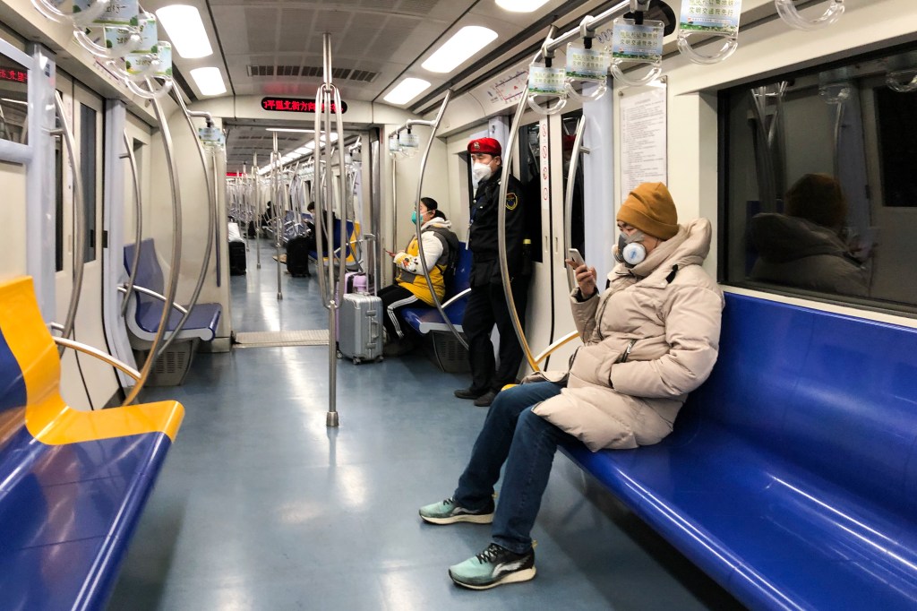 Man with mask on Beijing subway