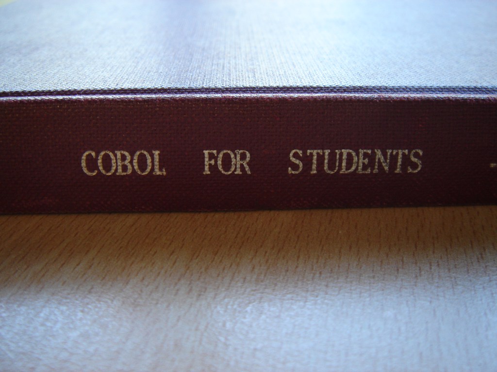 A textbook titled "COBOL forStudents"