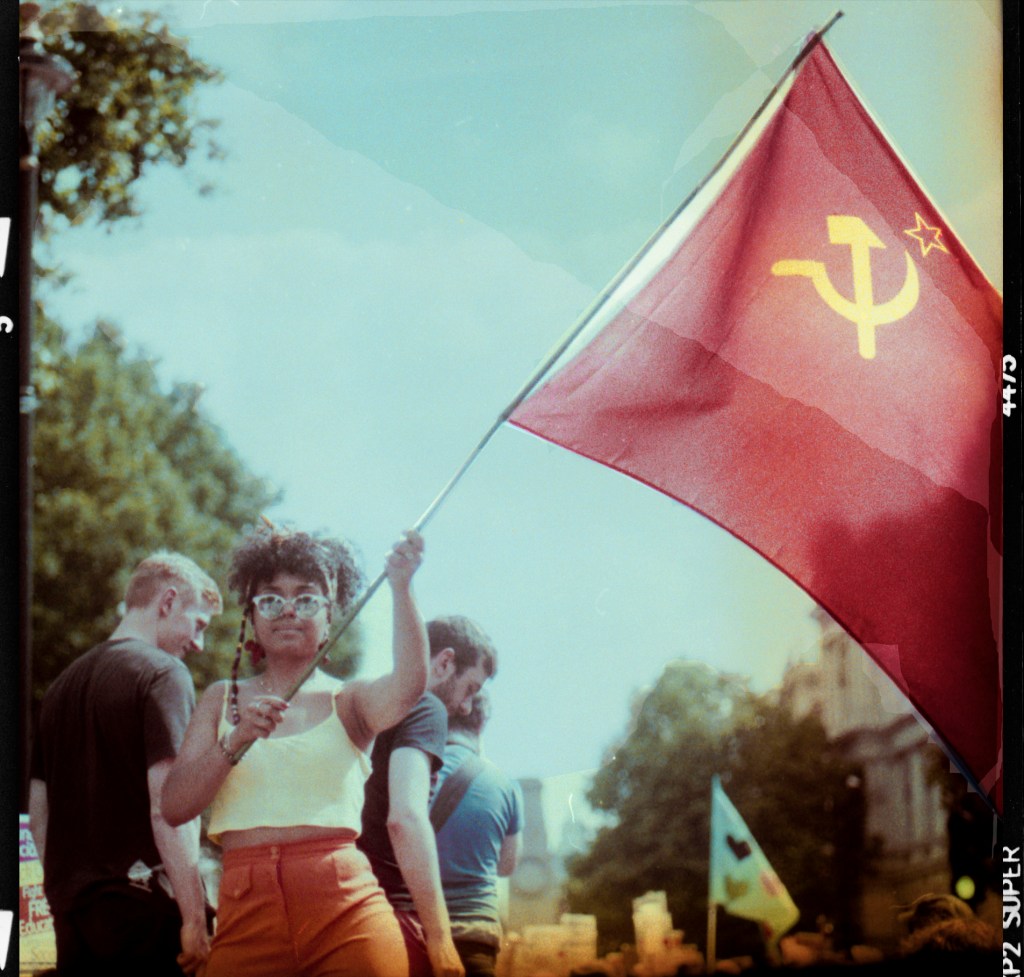 Young girl holding communist flag