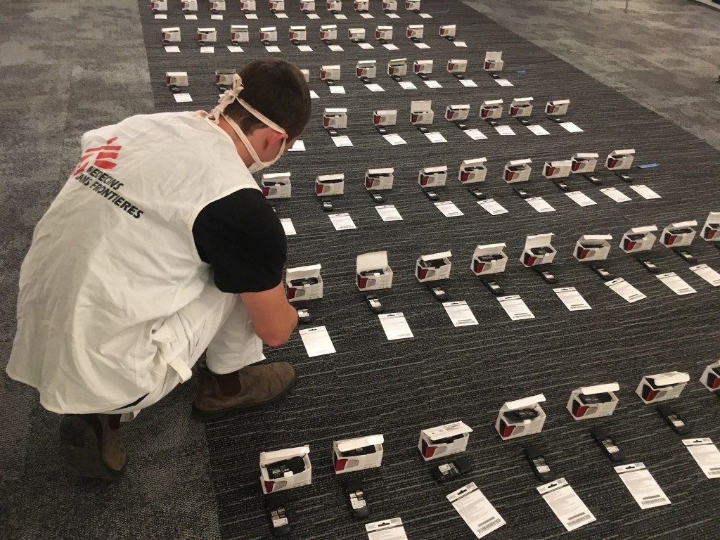 MSF Logistician Eric Schimdt prepares dozens of cellphones for distribution to the homeless in New York City.