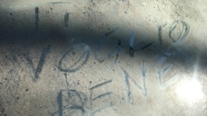 an Italian car with the words 'TI Voglio Bene' written in dust