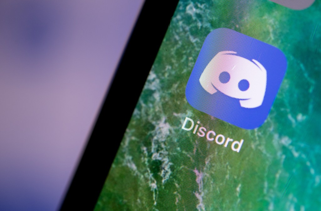 The Discord app is displayed on the screen of an iPhone.