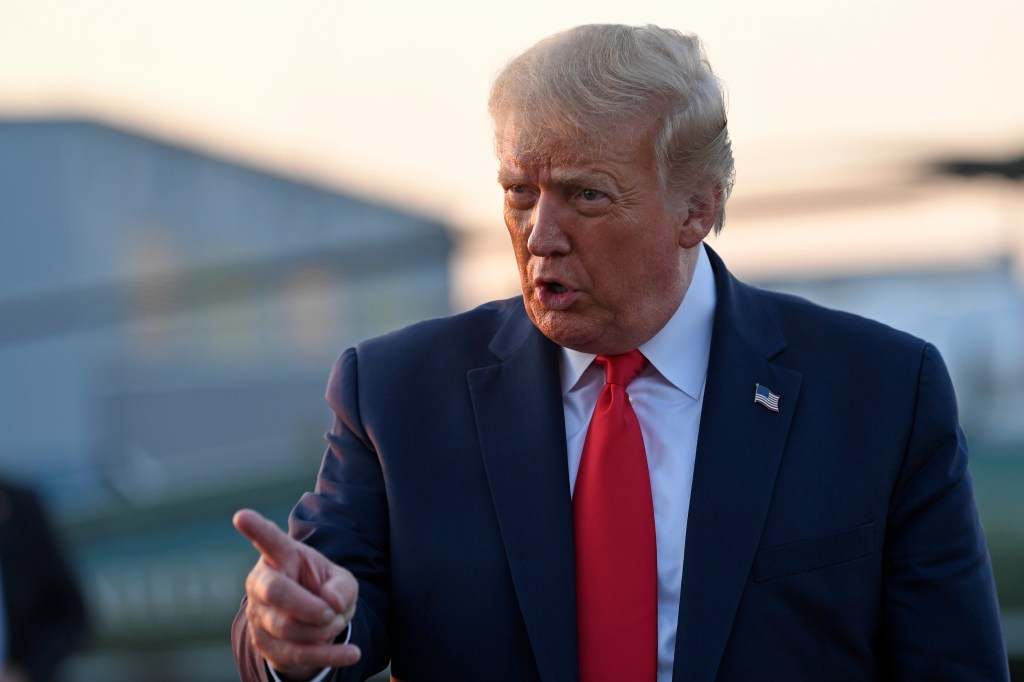 President Donald Trump talks with reporters before departing from Morristown Municipal Airport in Morristown, N.J., Sunday, Aug. 9, 2020. Trump was returning to Washington after spending the weekend at Trump National Golf Club.
