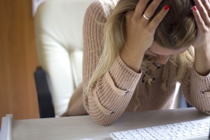 woman with head in her hands
