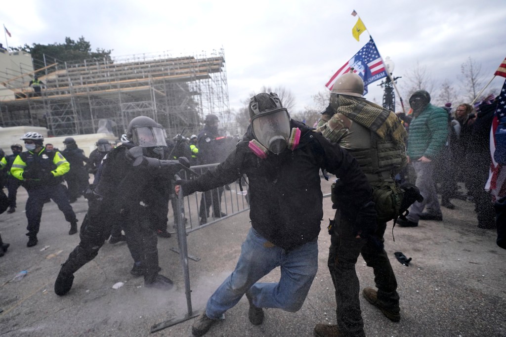 Trump supporters try to break through a police barrier, Wednesday, Jan. 6, 2021, at the Capitol in Washington. As Congress prepares to affirm President-elect Joe Biden's victory, thousands of people have gathered to show their support for President Donald