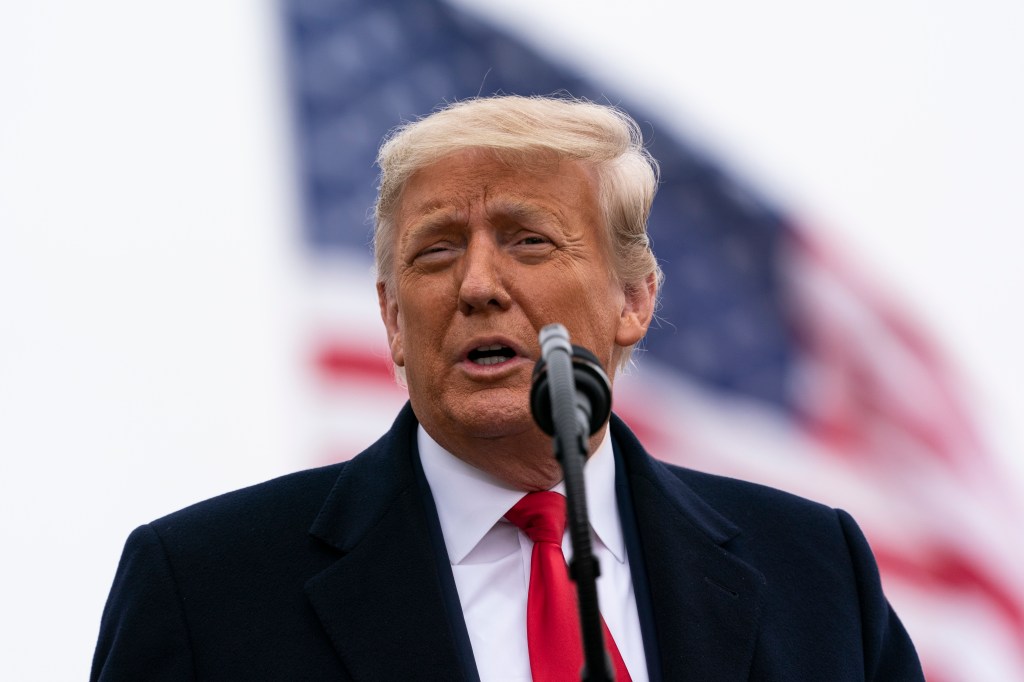 President Donald Trump speaks near a section of the U.S.-Mexico border wall, Tuesday, Jan. 12, 2021, in Alamo, Texas. (AP Photo/Alex Brandon)