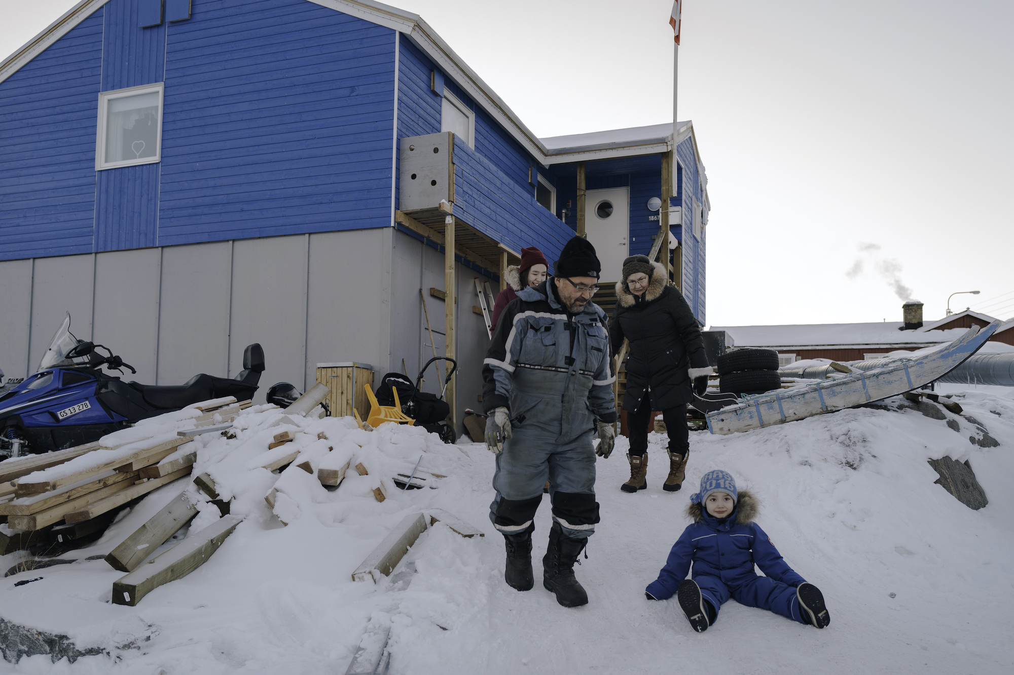 The Møller family outside their new home, nearly three years after the Nuugaatsiaq tsunami forced their evacuation to Uummannaq.