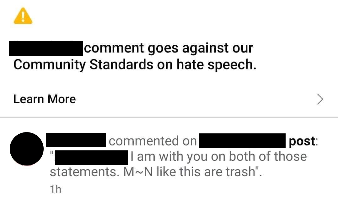 screenshot of a comment being removed for hate speech violation