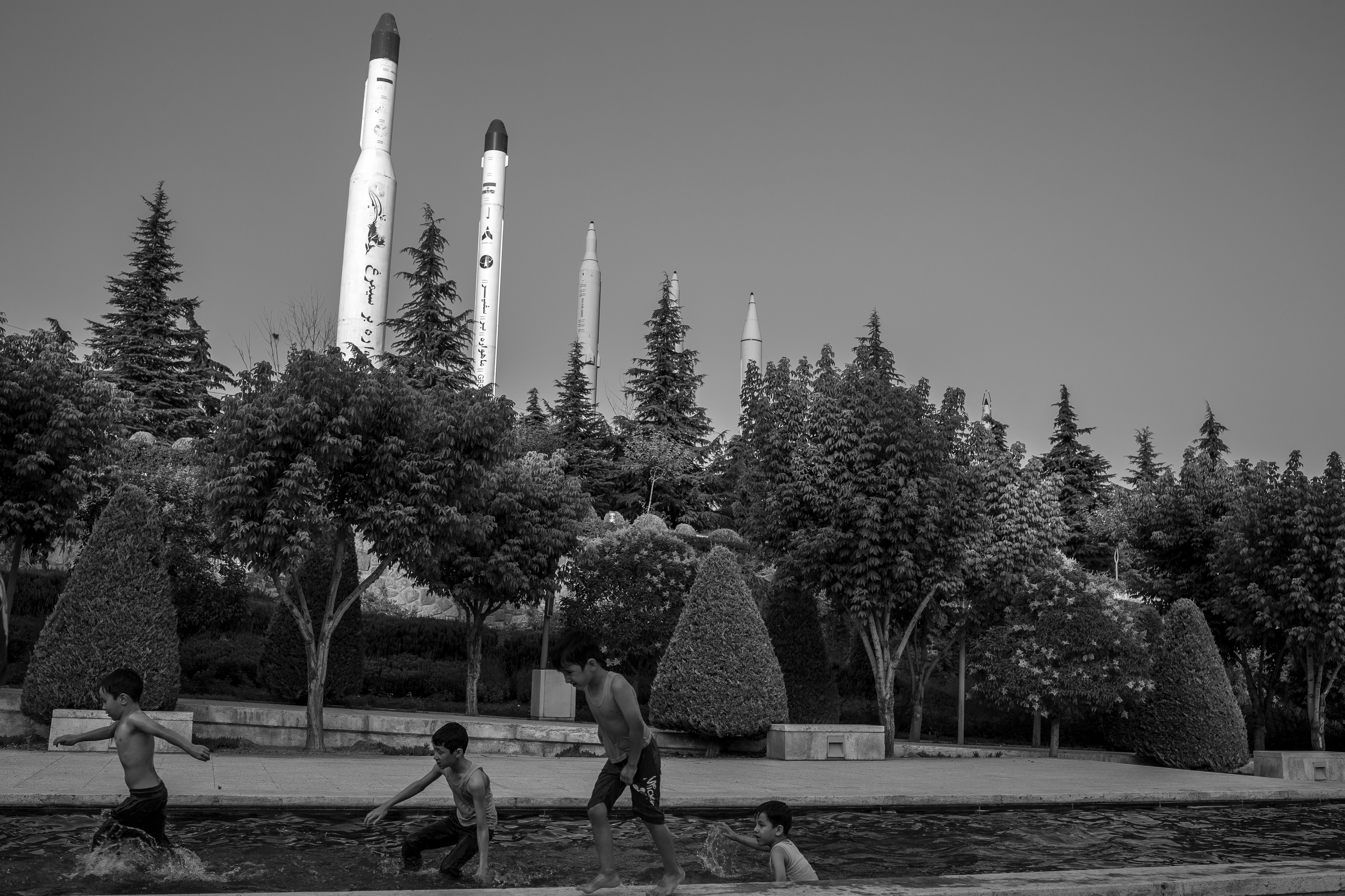 Kids play in front of Tehran's Holy Defence Museum, which commemorates the Iran-Iraq war. Iran has invested heavily in the missile industry. Photo: Hossein Kazemi/ Middle East Images