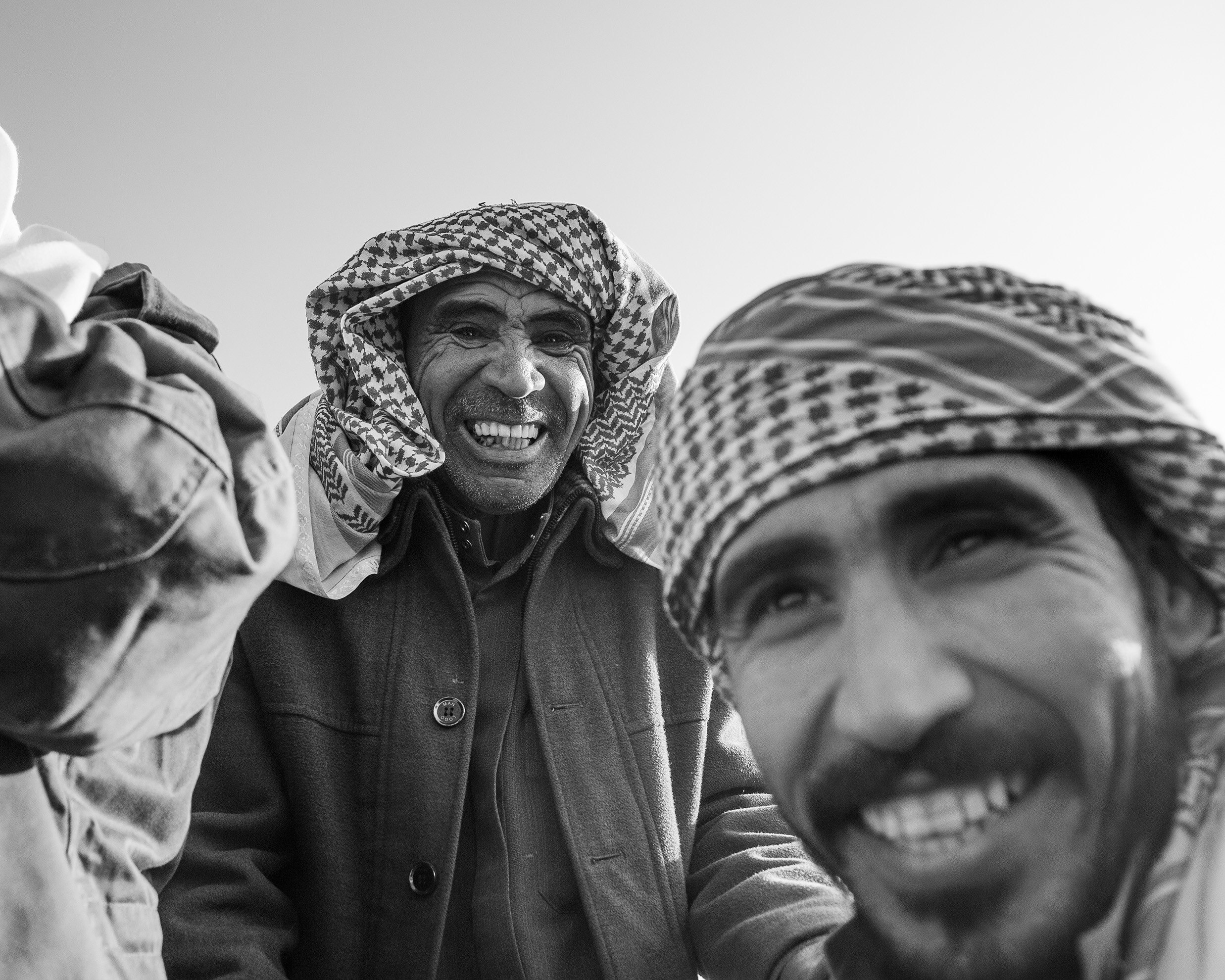 Wadi Zalaqa – Two Bedouin men wearing the traditional Keffiyeh headscarf and smiling.