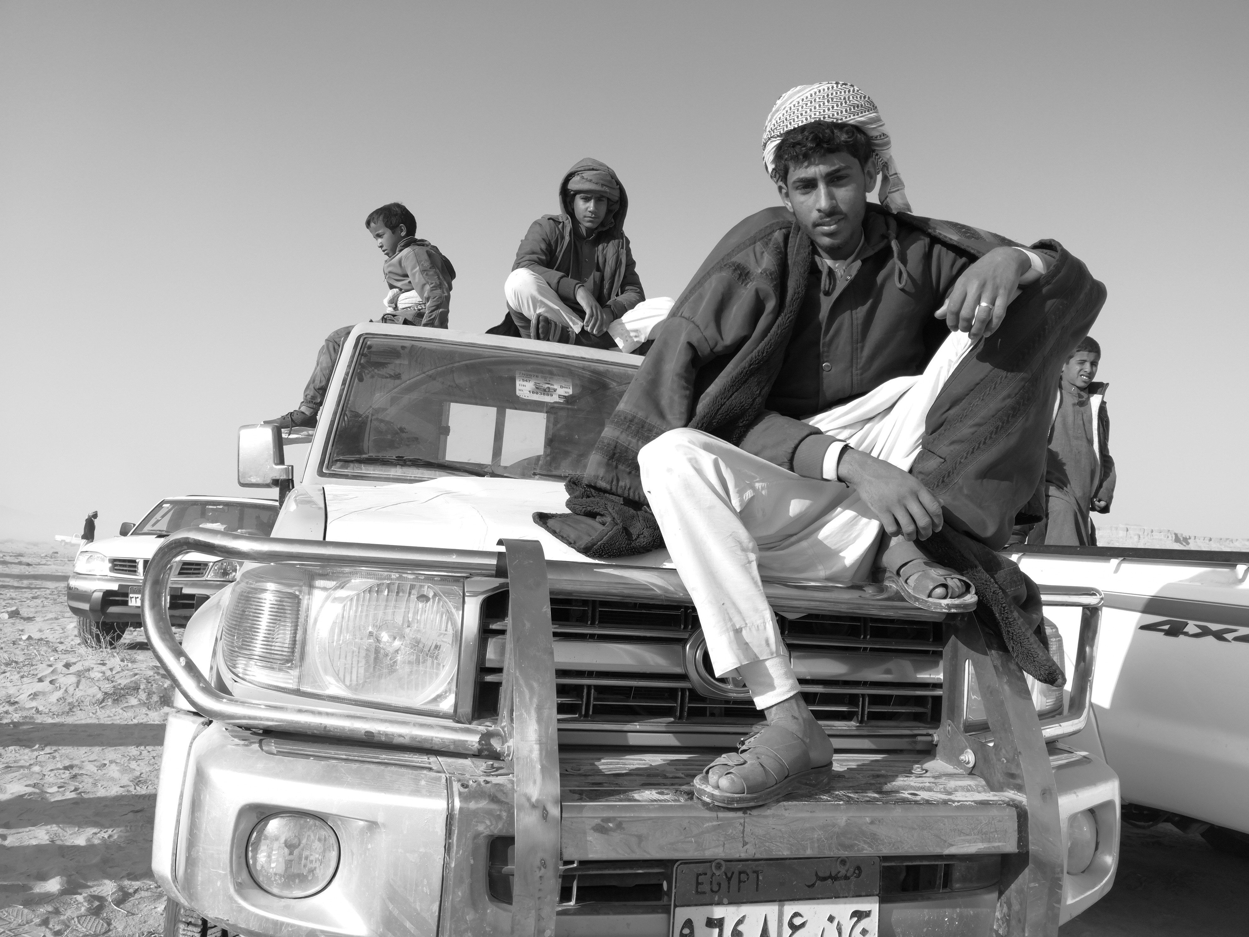 Wadi Zalaqa– Bedouin men sitting on their 4x4.