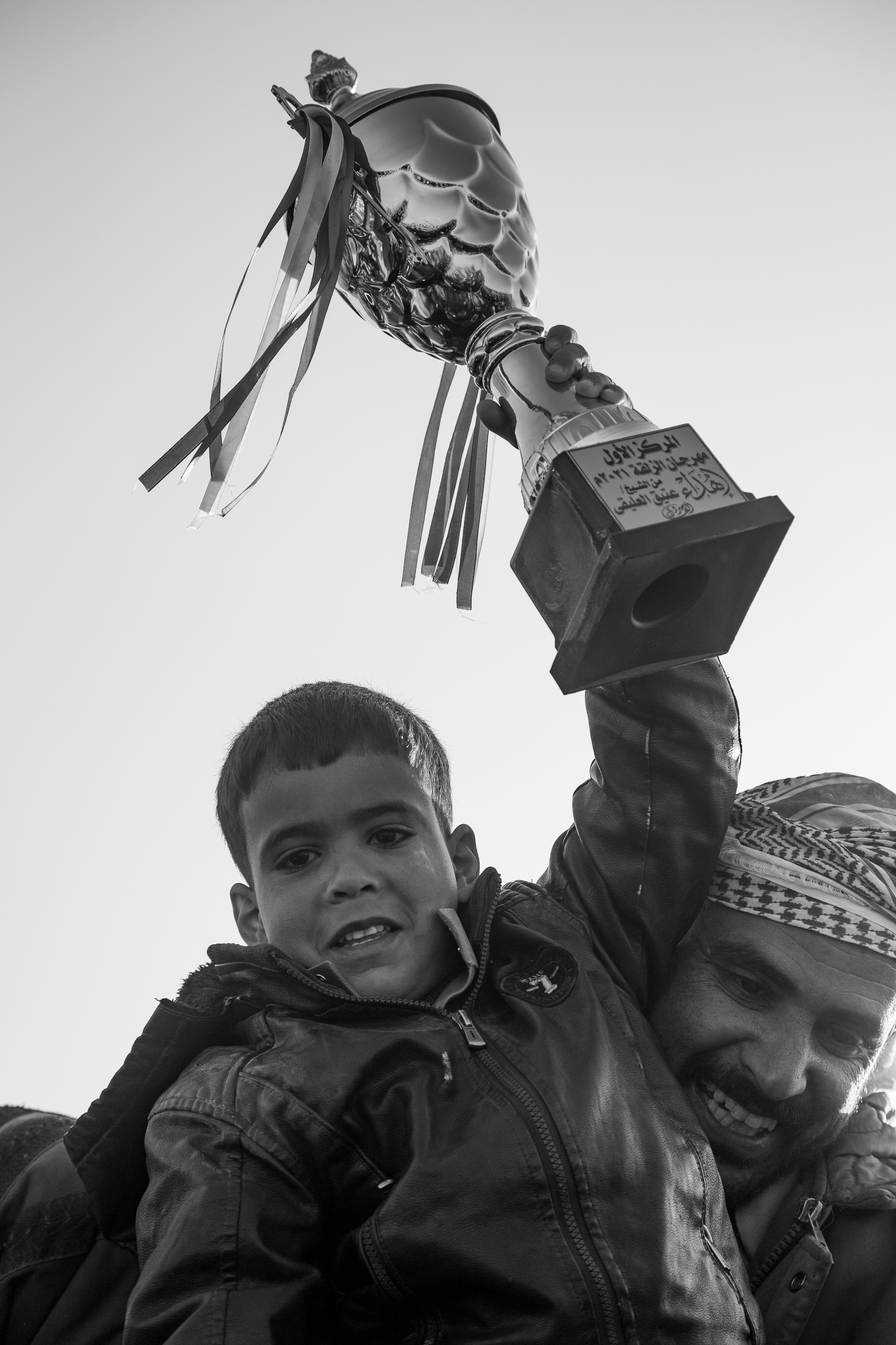 Wadi Zalaqa - a kid holding up a trophy.