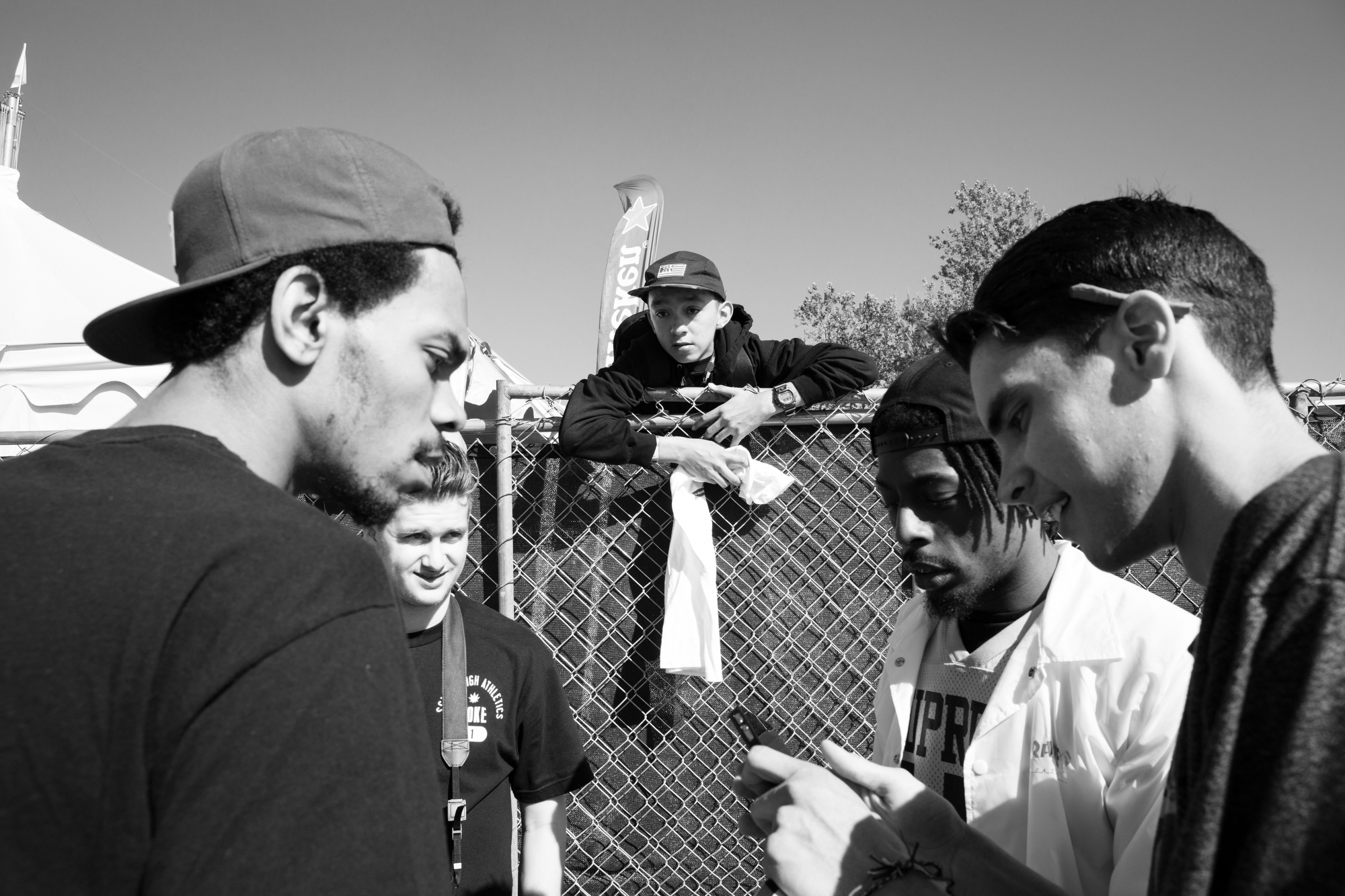 People talking at a music festival.