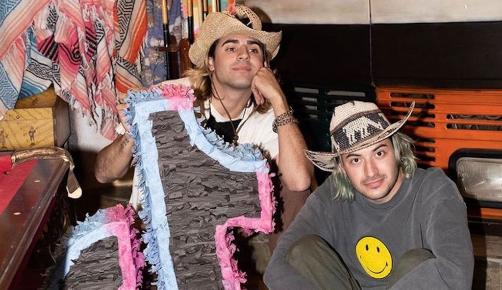 Ivy and X with a pinata in the shape of the logo for TikTok