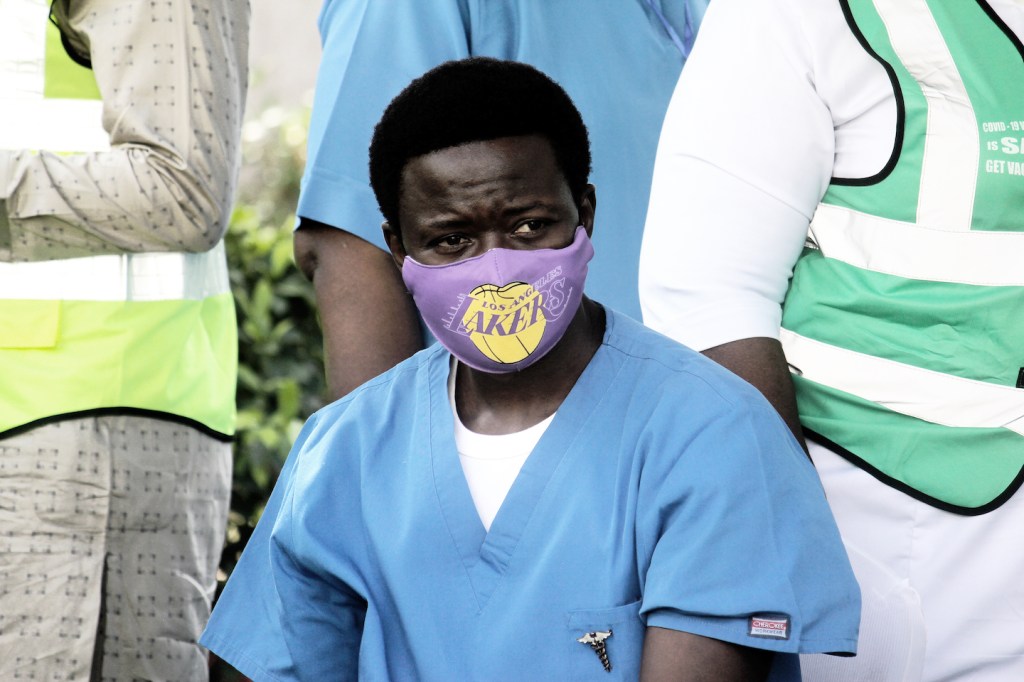 Healthcare workers at Nigeria's National Hospital wait to get vaccinated.
