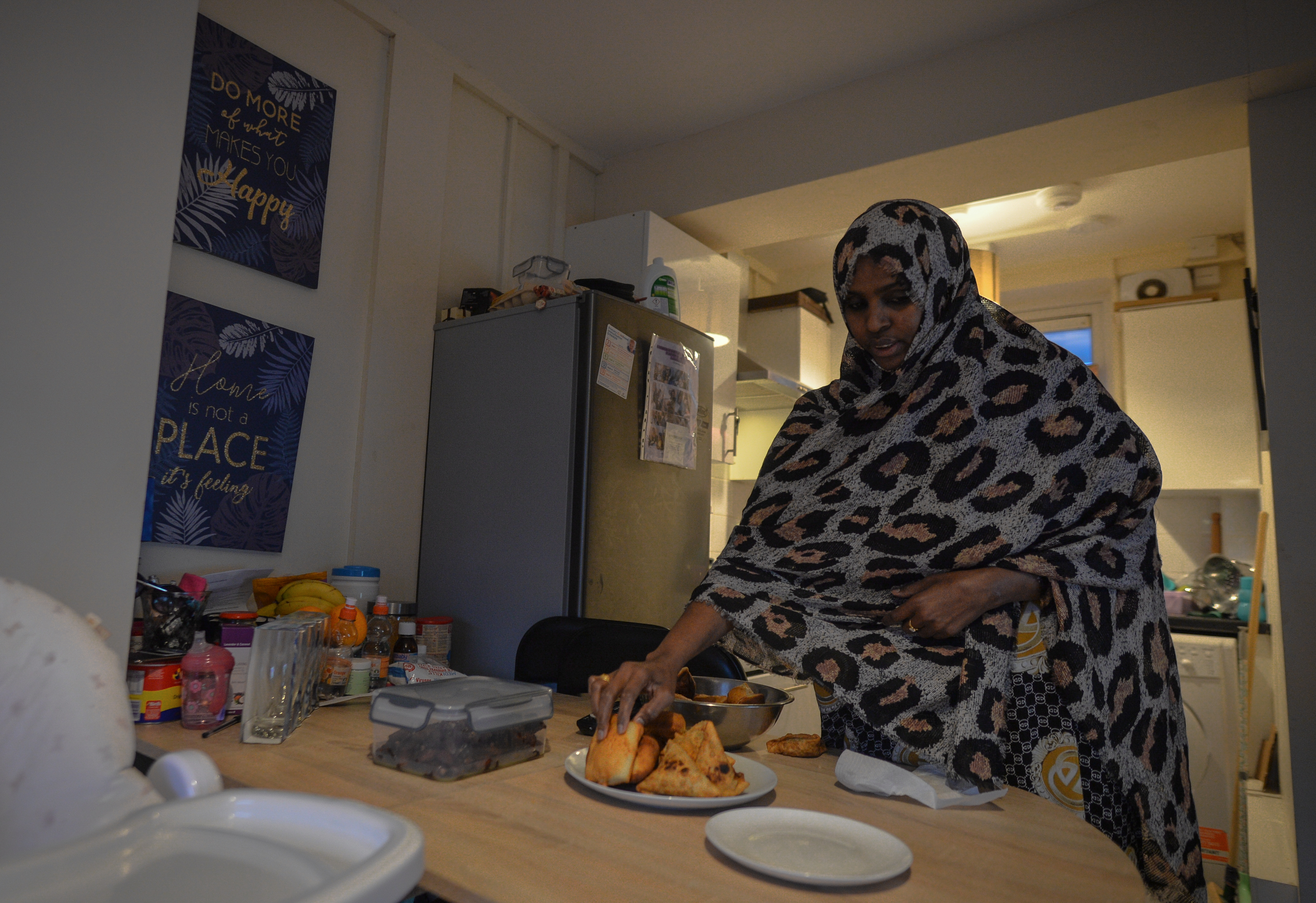 Ifrah Ahmed, a Somali-Irish woman living in Dublin, prepares her iftar dinner inside her apartment. Photo: Artur Widak/NurPhoto via Getty Images