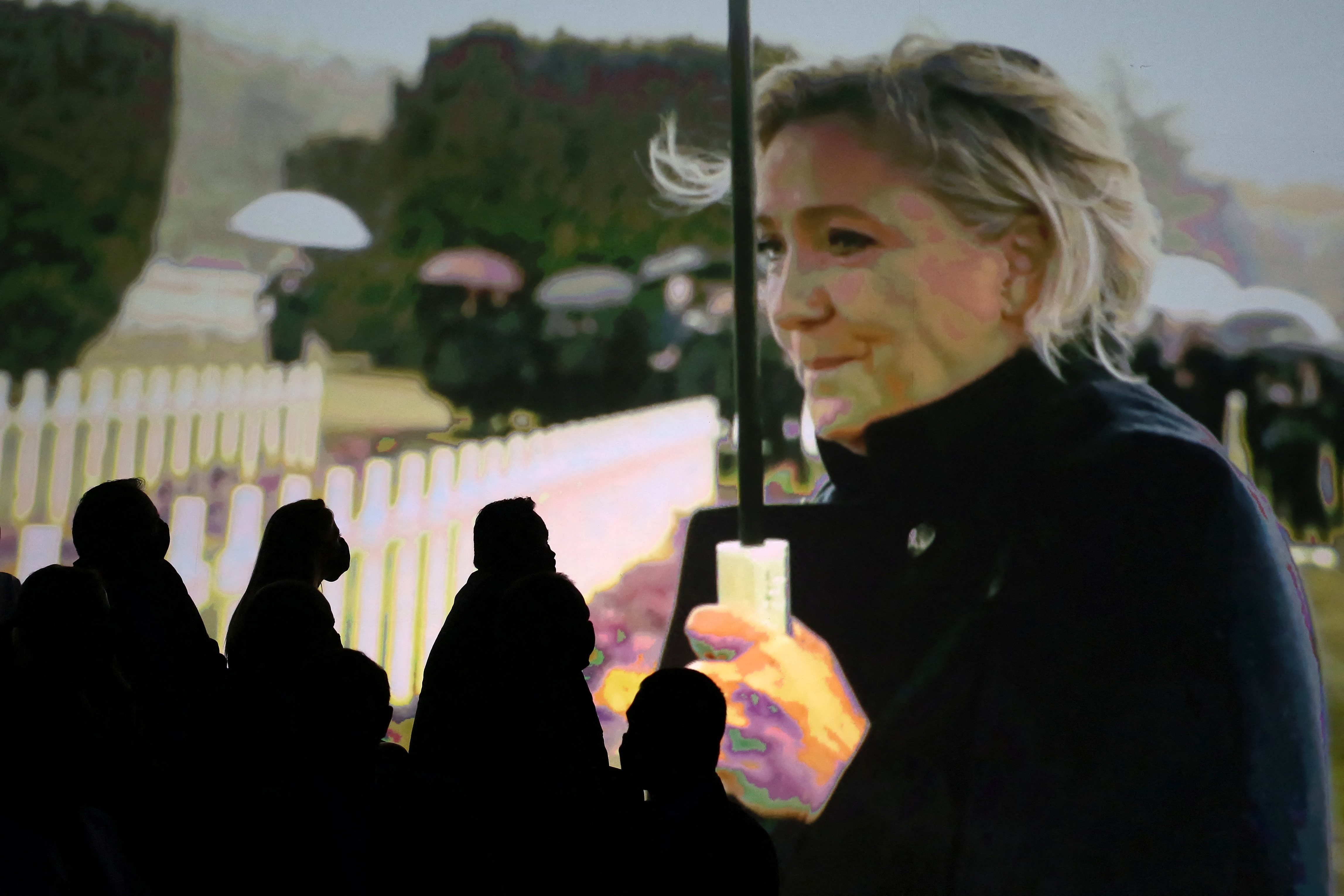 Supporters watch a film of Marine Le Pen at a party gathering. Photo: VALENTINE CHAPUIS/AFP via Getty Images