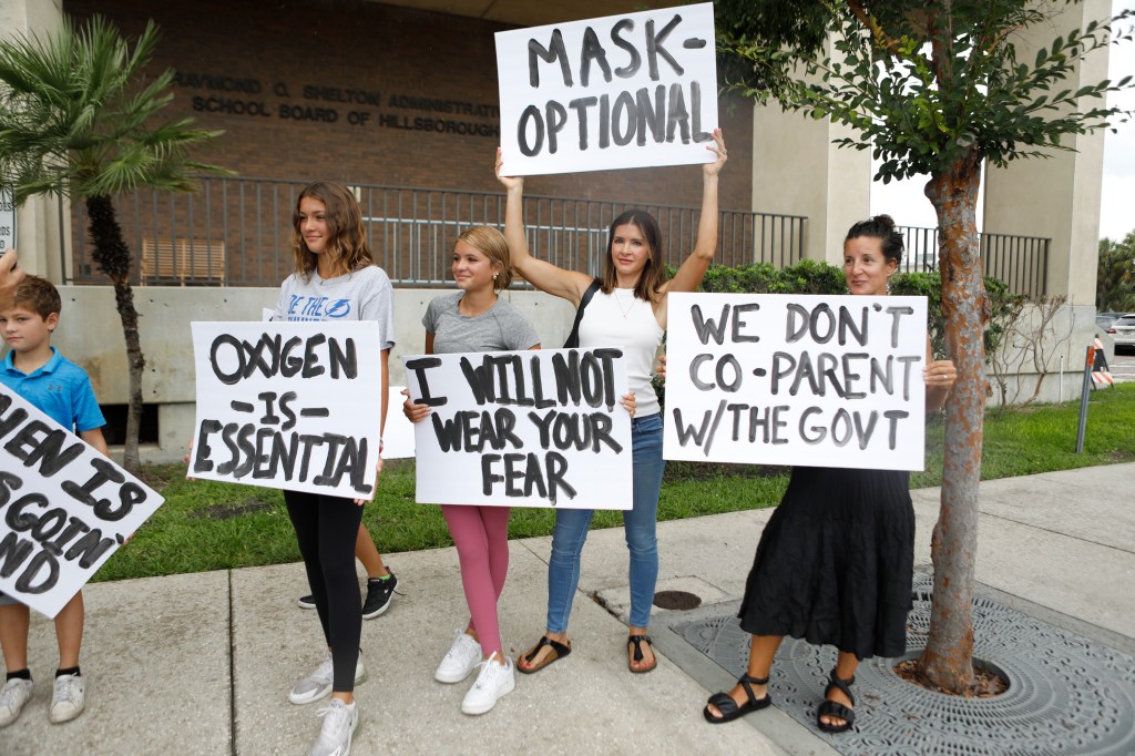 Families protest any potential mask mandates before the Hillsborough County Schools Board meeting held at the district office on July 27, 2021 in Tampa, Florida. The Centers for Disease Control and Prevention recommended those who are vaccinated should we