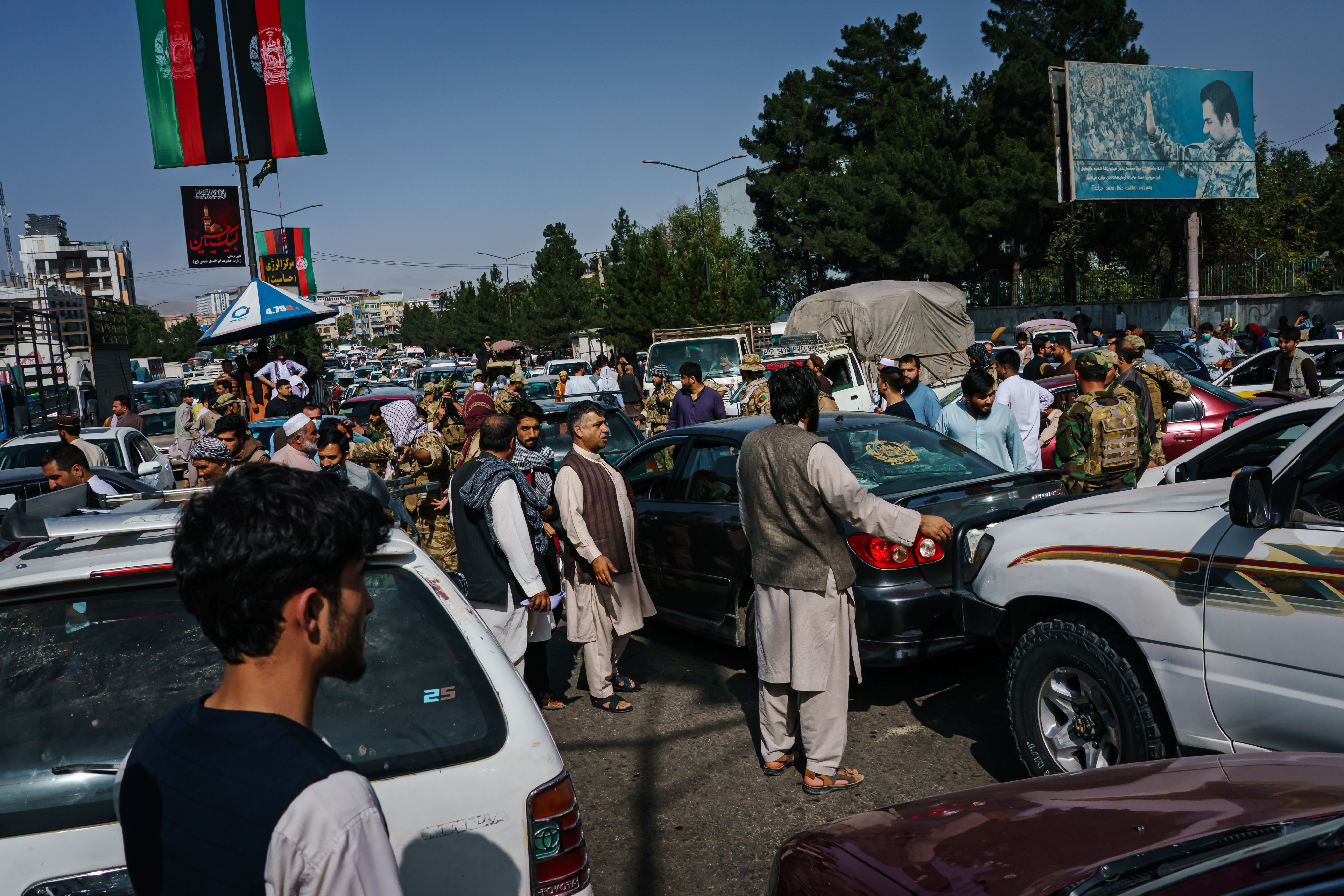 Pedestrians and motorists end up in a traffic grid lock trying to flee Kabul, Afghanistan before the Taliban takes over the city on Sunday, Aug. 15, 2021.