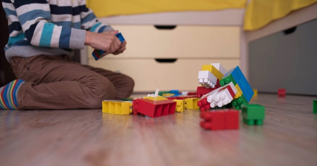 Child playing with lego