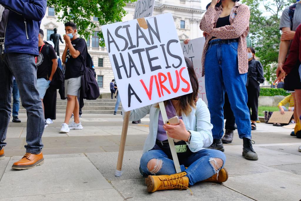 A protester at a Stop Asian Hate rally as hate crimes triple during the course of the pandemic in the UK. Photo: Eleventh Hour Photography / Alamy Stock Photo