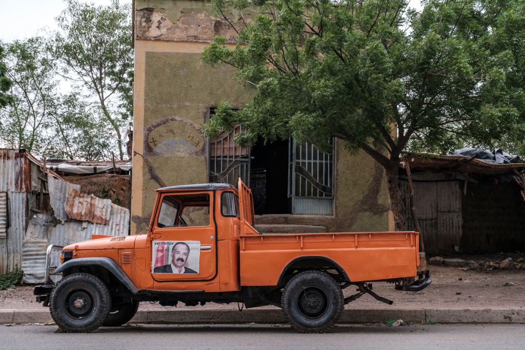 A truck with a poster depicting Eritrea's Isaias Afwerki, parked in a street in Humera, Ethiopia, in July this year. Photo: EDUARDO SOTERAS/AFP via Getty Images