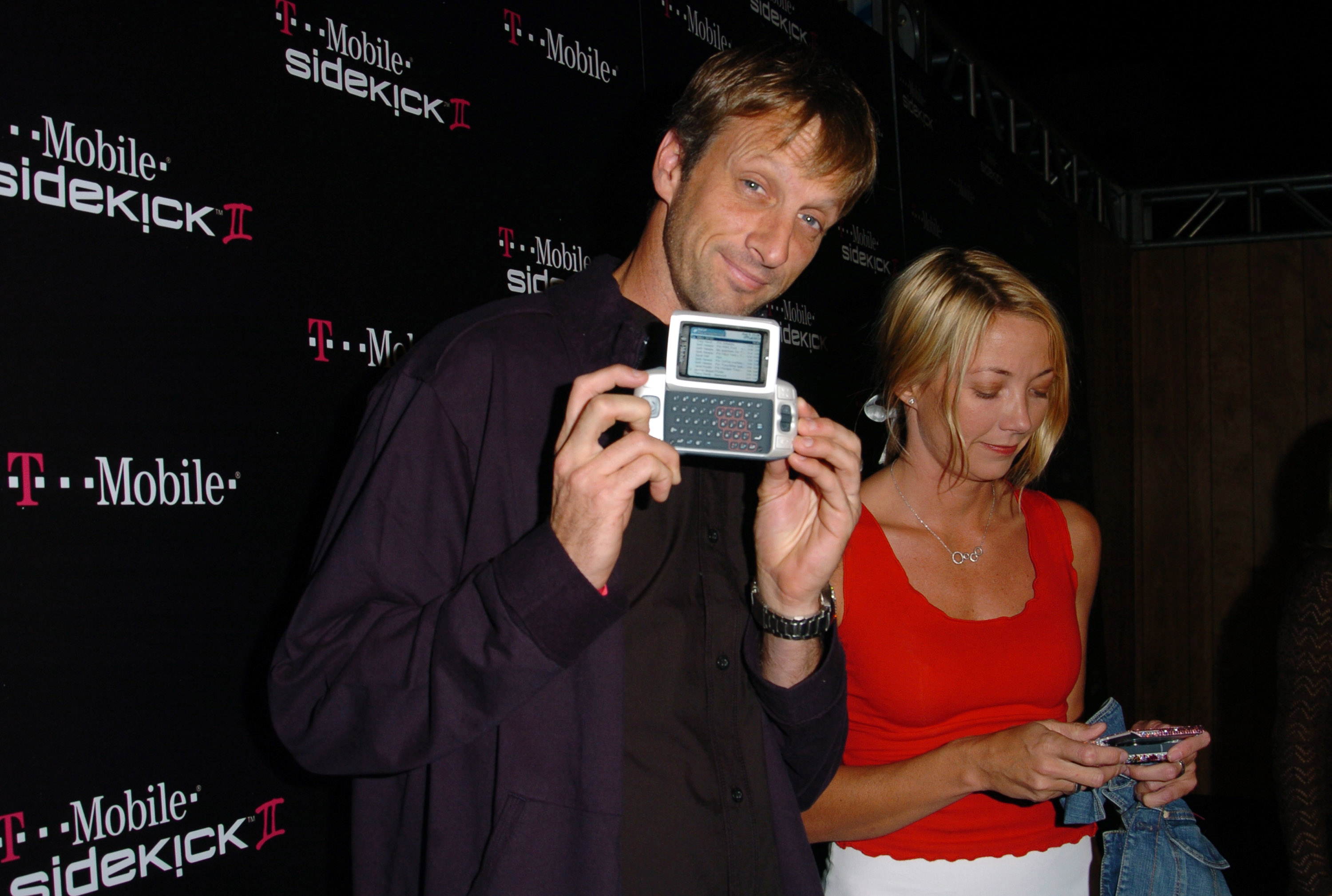 Tony Hawk holding a Sidekick II