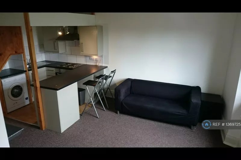 A black sofa in a one-bed rental in Sheffield