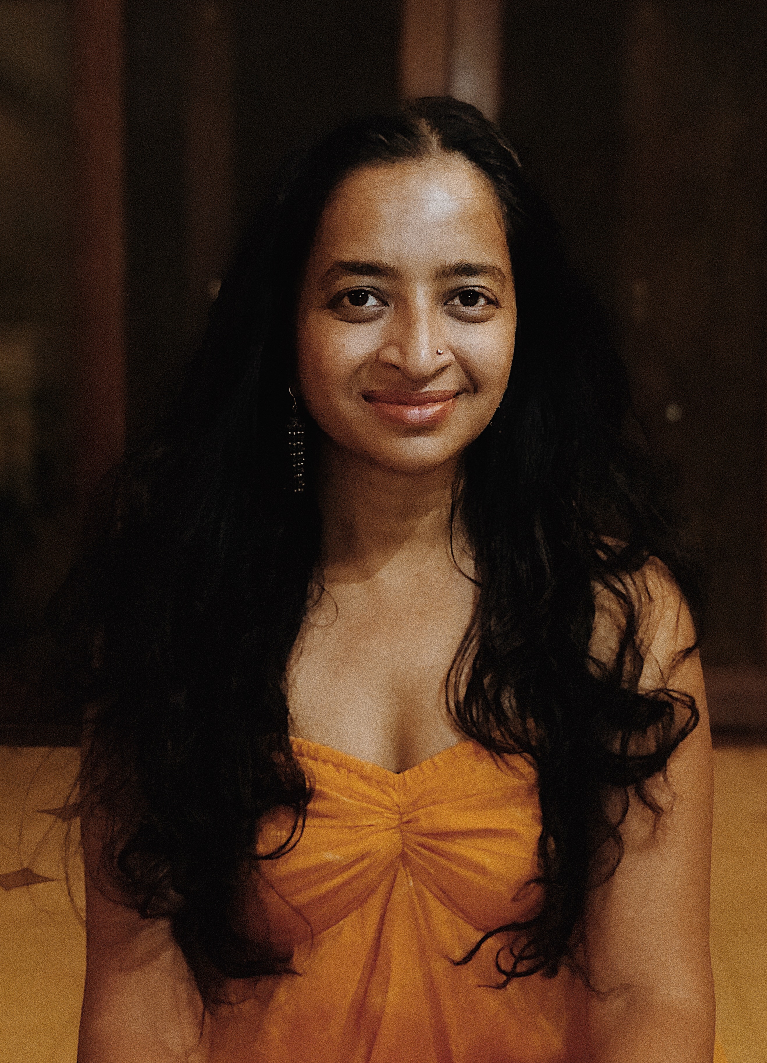 Picture of an artist in a yellow dress