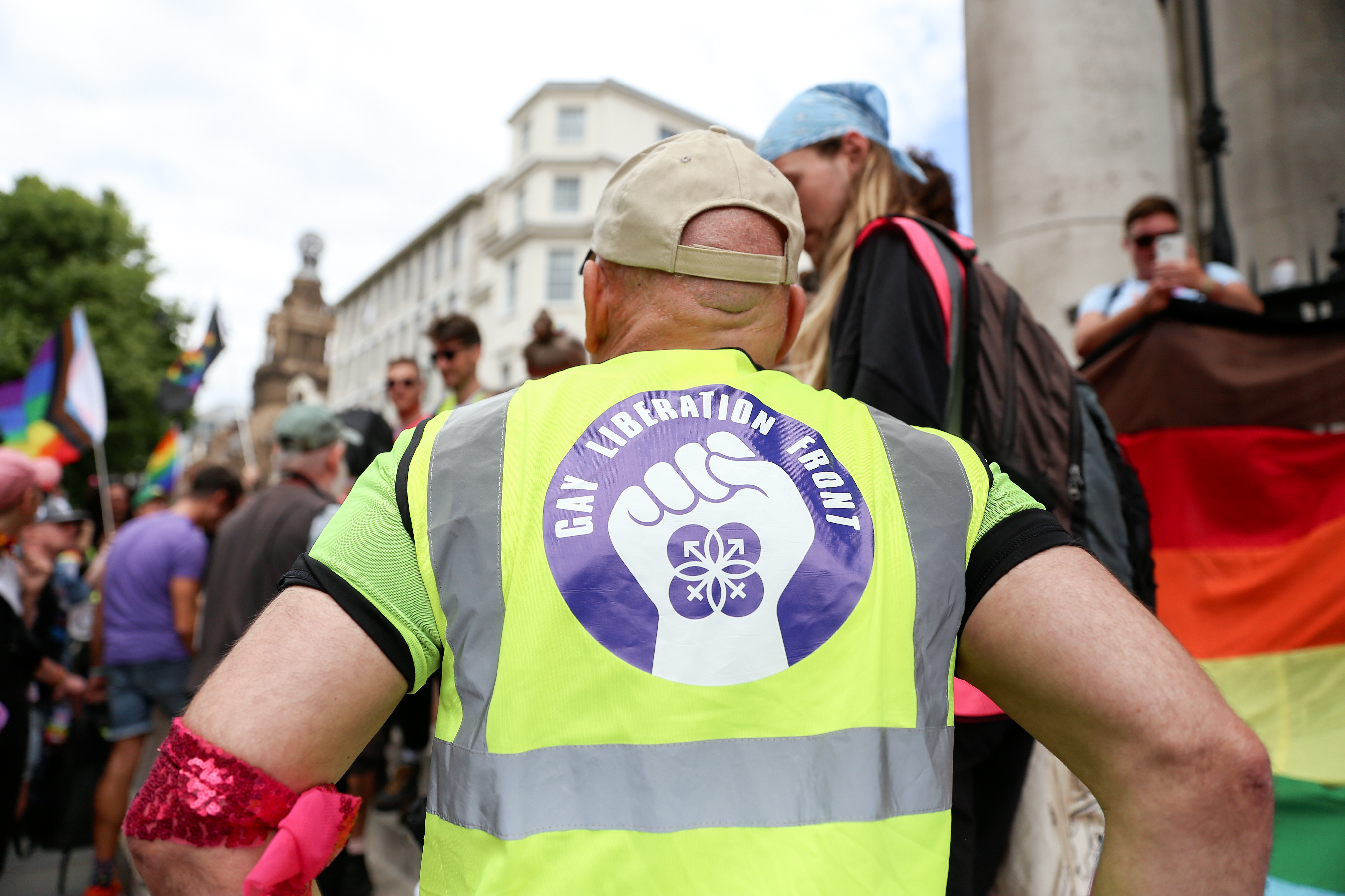 Man waring Gay Liberation Front hi-ves vest